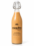 Pumpkin Coquito bottle, a traditional Puerto Rican coconut drink with pumpkin and warm fall spices by Nura Renüa